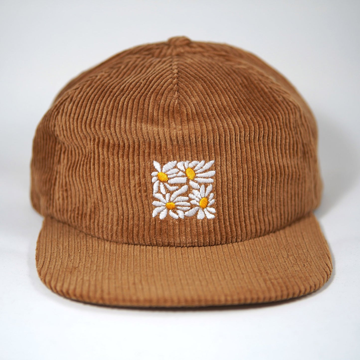 High quality flat-brimmed corduroy hat with embroidered flower design by our designer Hannah Kneisley.