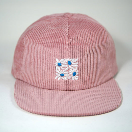 High quality flat-brimmed corduroy hat with embroidered flower design by our designer Hannah Kneisley.