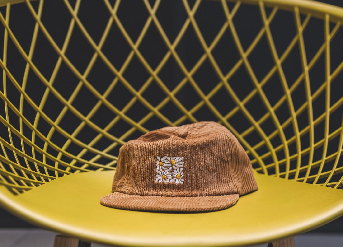 High quality flat-brimmed corduroy hat with embroidered flower design by our designer Hannah Kneisley.