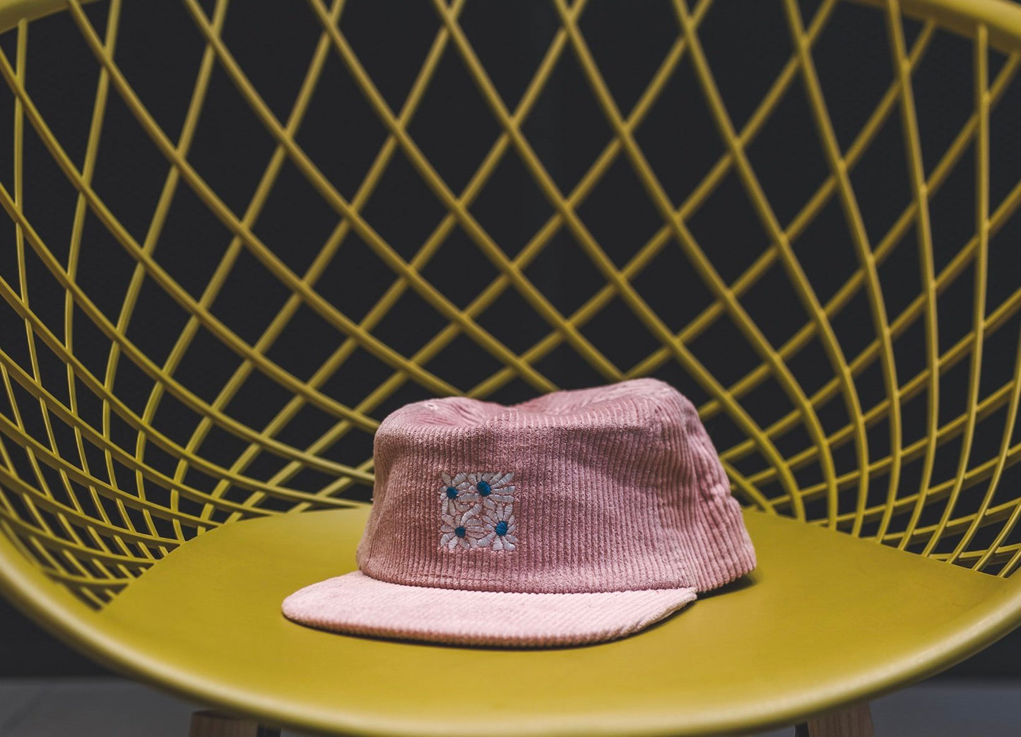 High quality flat-brimmed corduroy hat with embroidered flower design by our designer Hannah Kneisley.