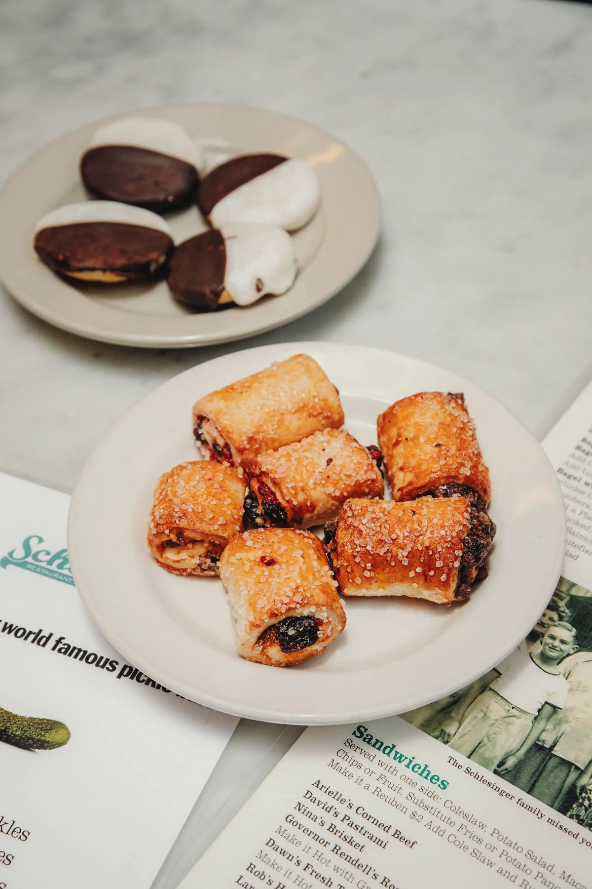 Pastries on a plate with a magazine underneath