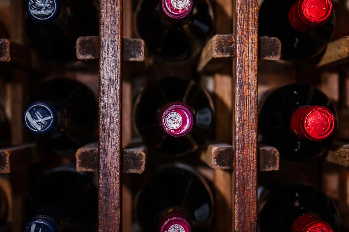 Close-up of wine bottles in a wooden rack