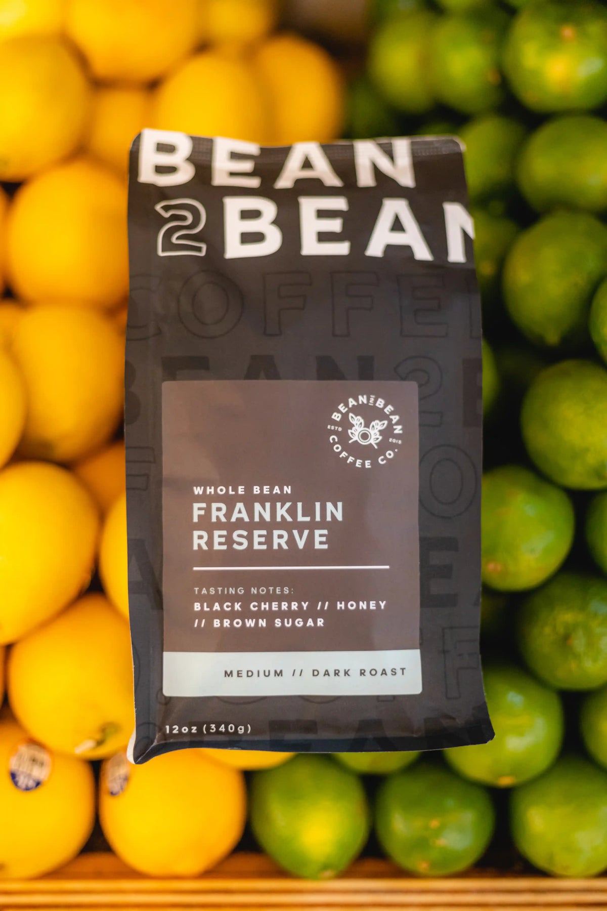 Bean2Bean coffee package with lemons and limes in the background