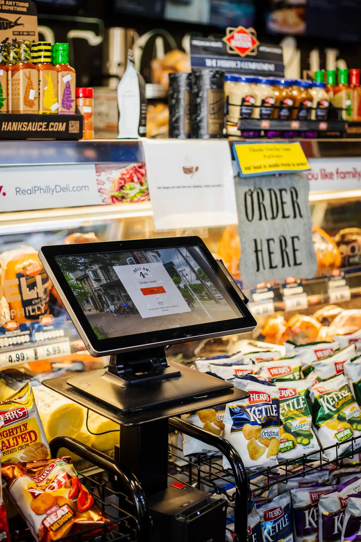 checkout screen at deli on 4th in front of cold case