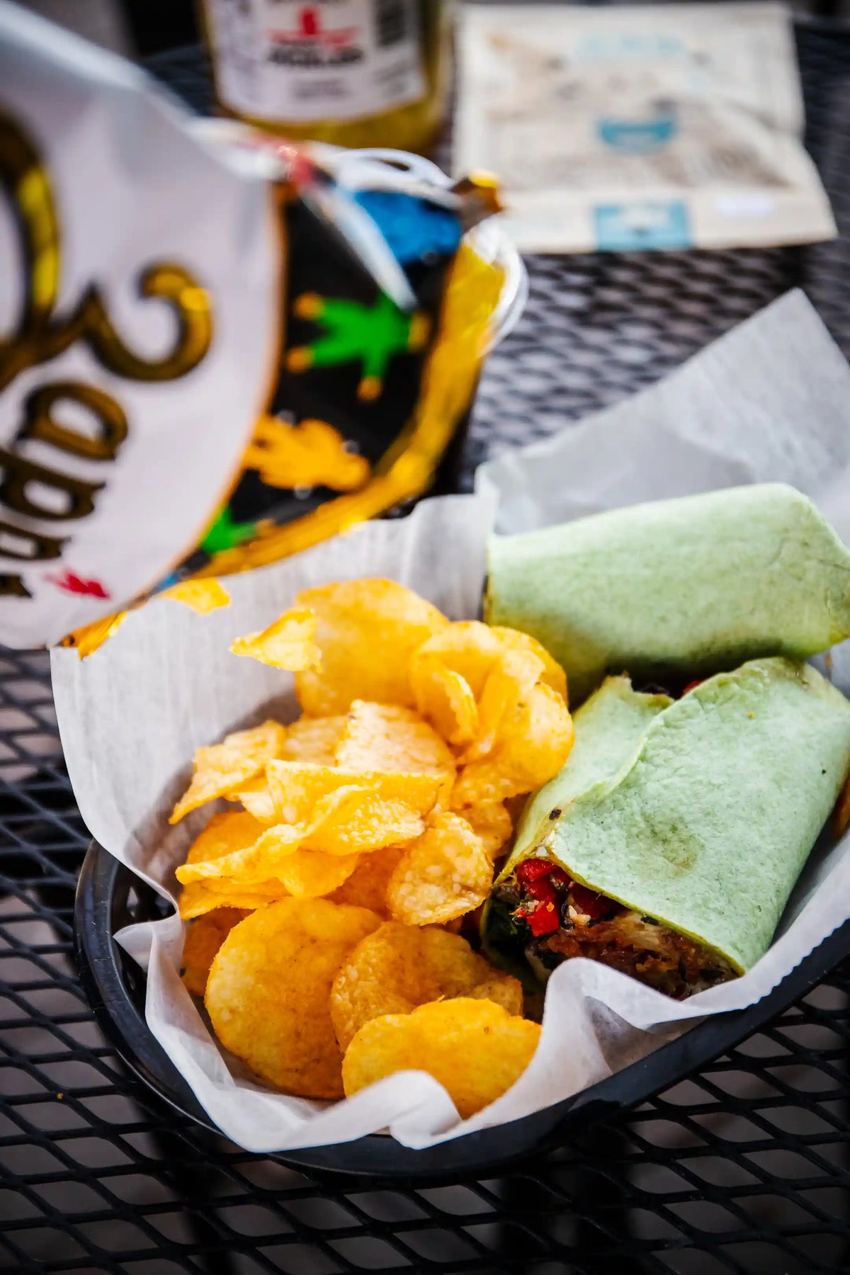 Zapp's potato chips being poured into a basket containing a breakfast wrap