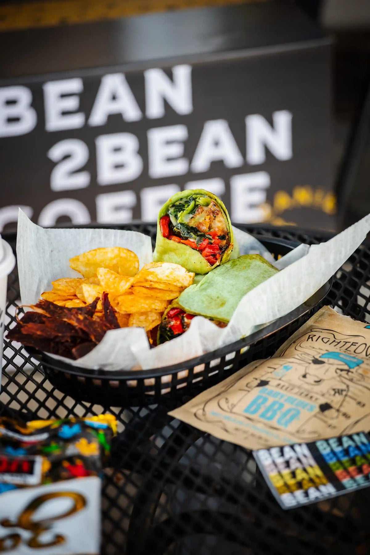 breakfast wrap in basket with chips and beef jerky