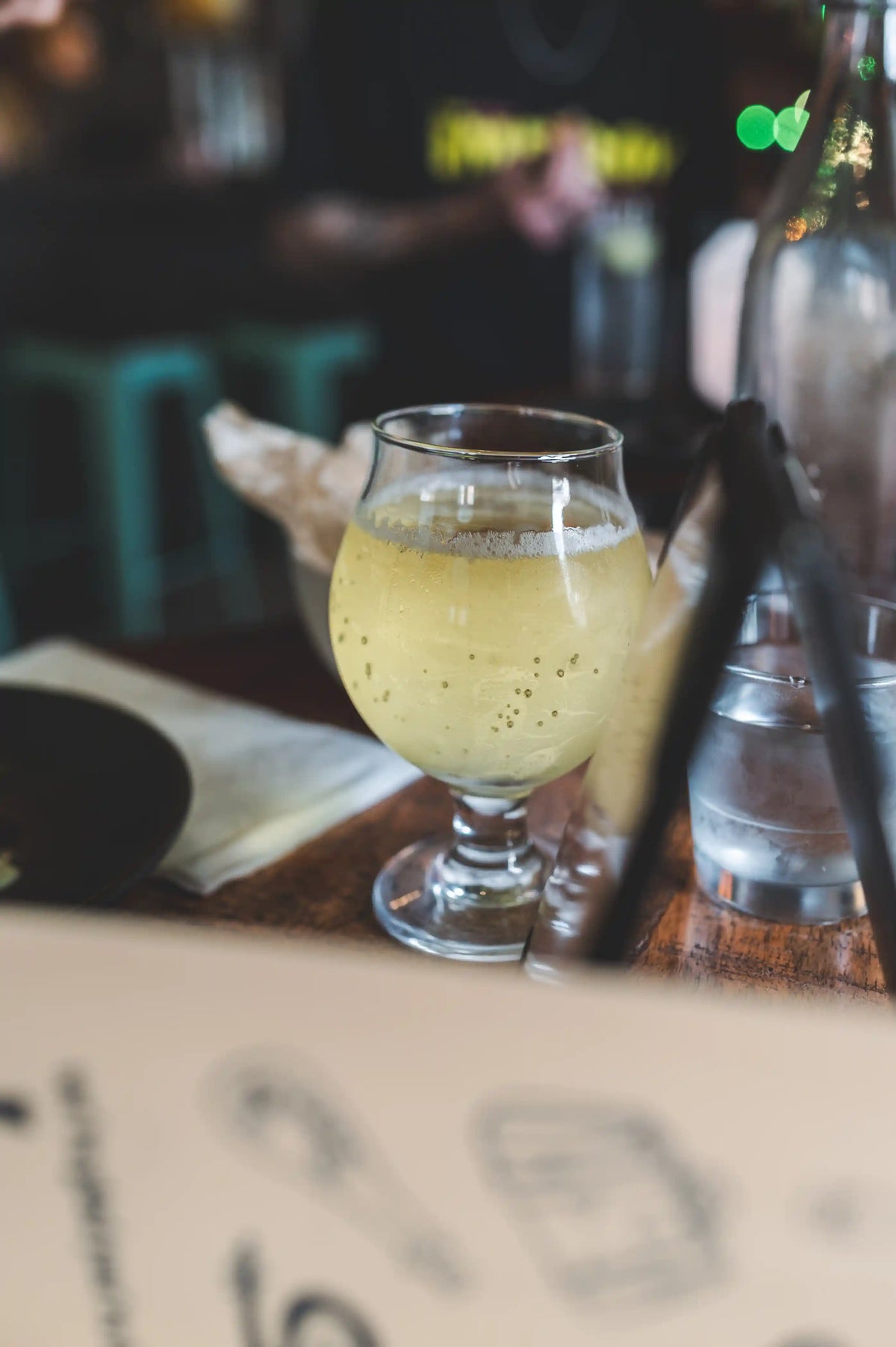 Bubbly cocktail in short glass on bar at International Bar in Philadelphia,PA
