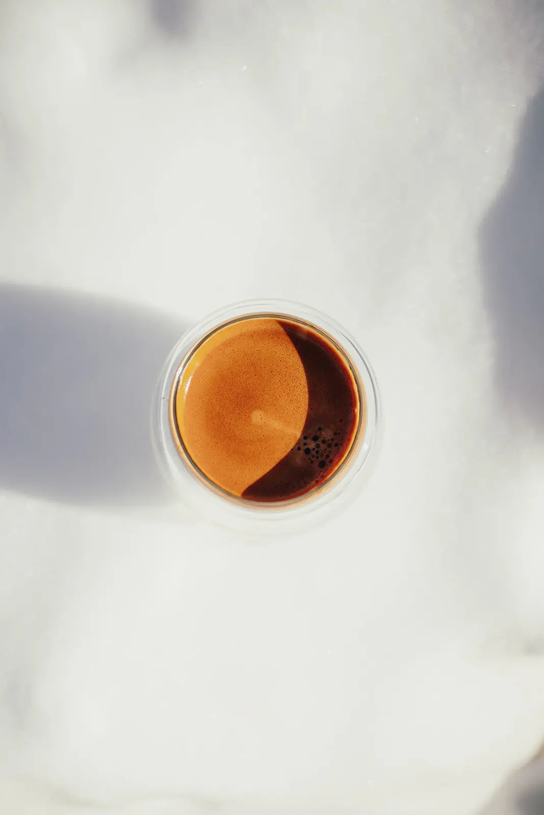 Close-up of an espresso cup with a white background