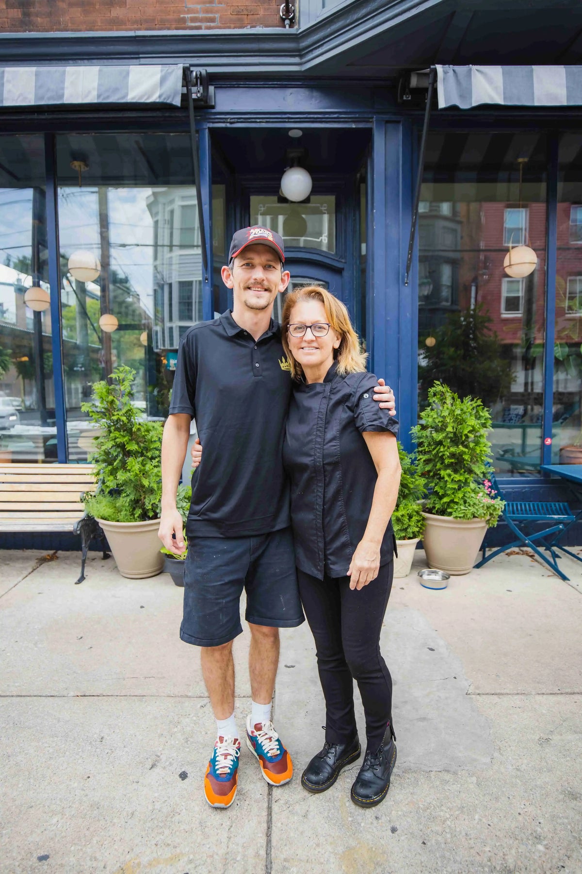 owners of Fitz on 4th outside the storefront on sidewalk
