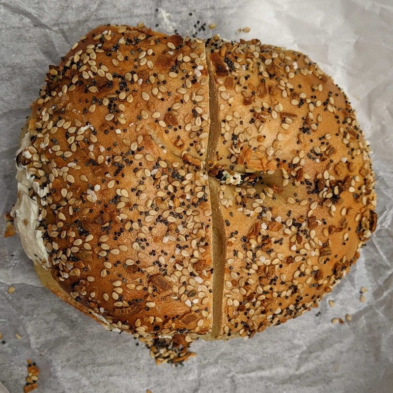 Everything bagel on a crumpled paper background
